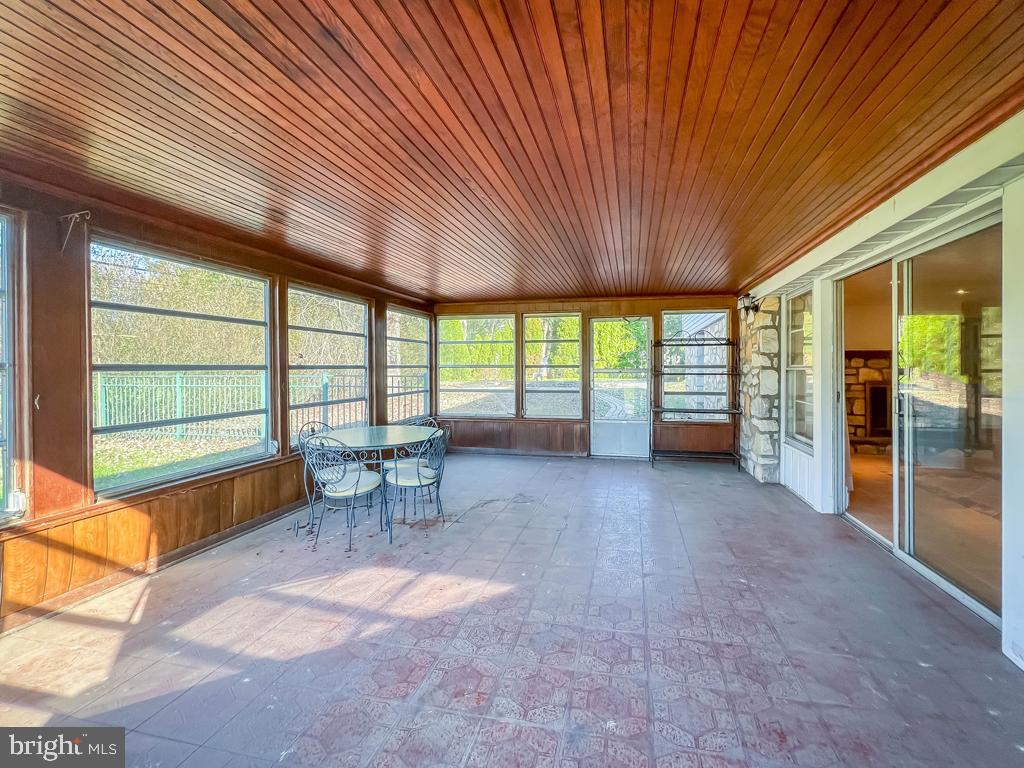 883 Parkwood Road Blue Bell, PA 19422 - Photo 35 of 65 Sunroom overlooks pool and back yard