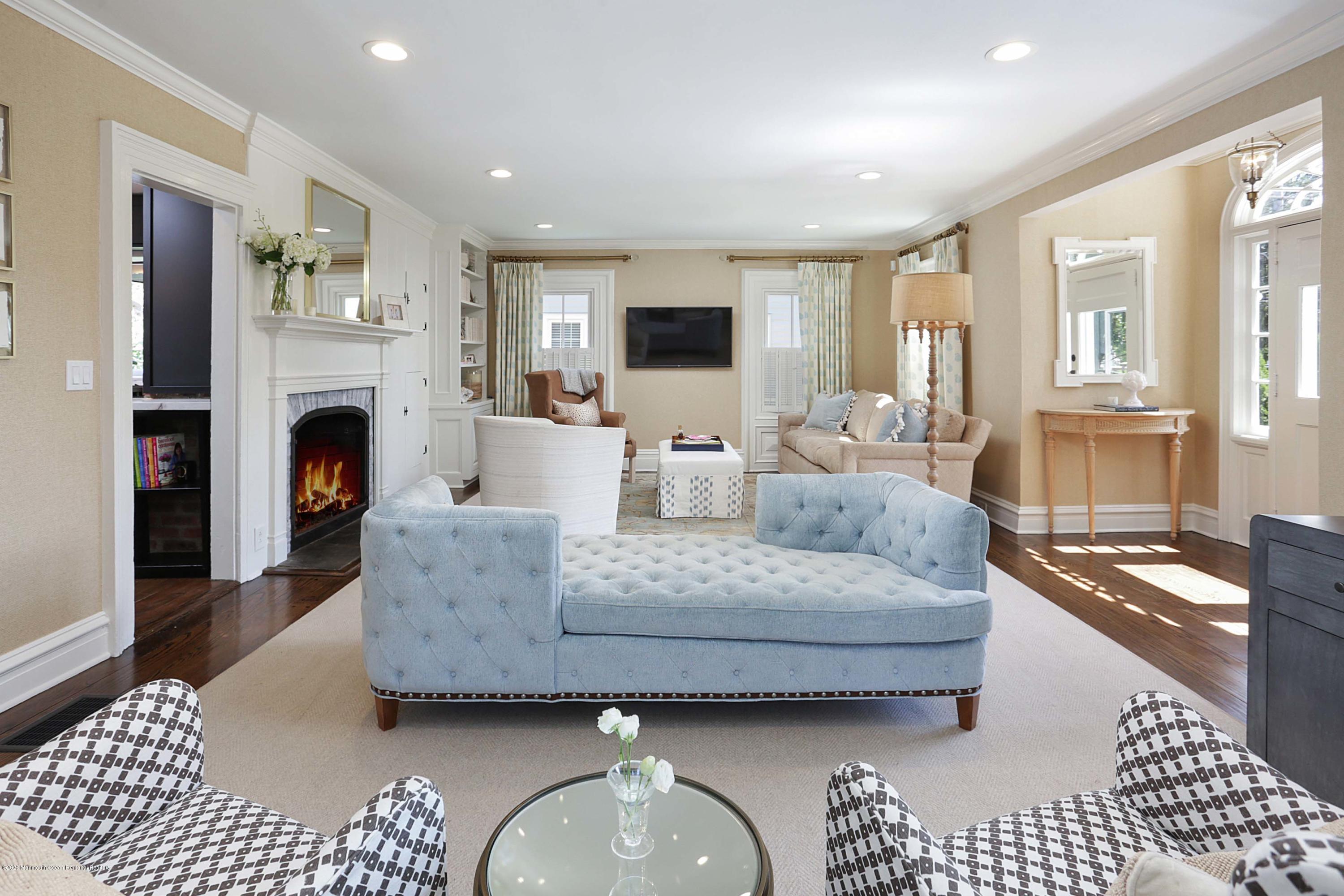 189 Rumson Road Little Silver, NJ 07739 - Photo 5 of 30 a living room with furniture a fireplace and a flat screen tv