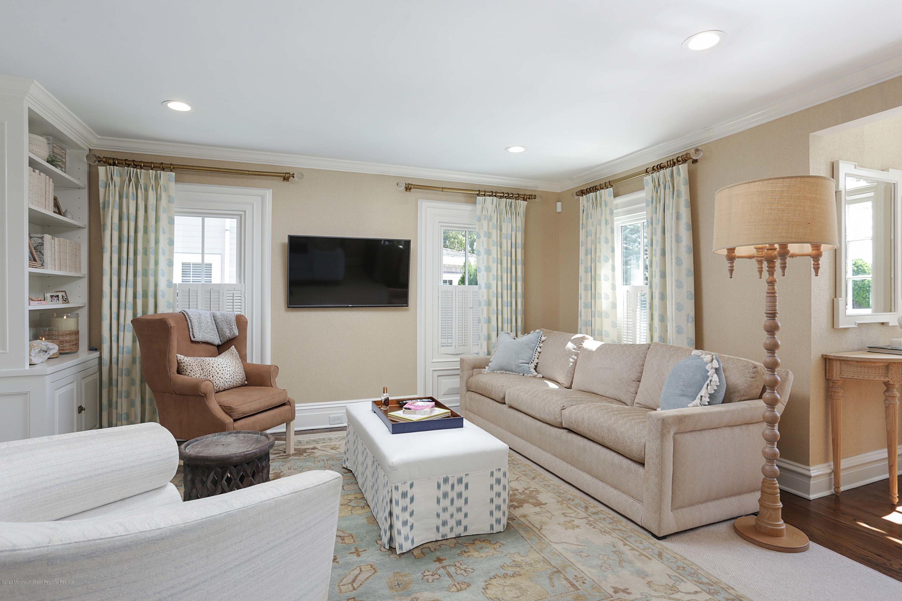 189 Rumson Road Little Silver, NJ 07739 - Photo 7 of 30 a living room with furniture and a flat screen tv