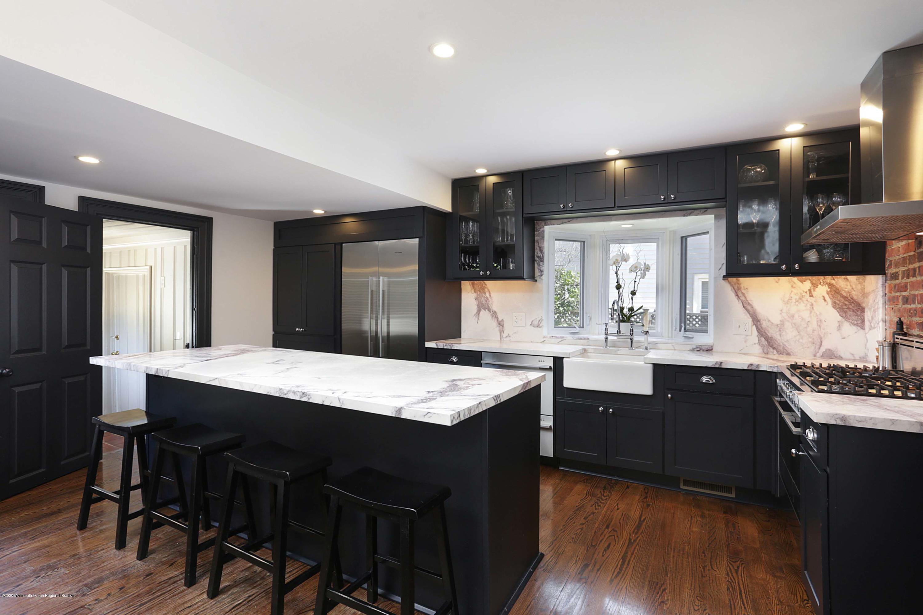 189 Rumson Road Little Silver, NJ 07739 - Photo 8 of 30 a kitchen with granite countertop a sink appliances and wooden floor