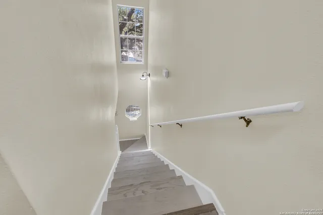 a view of a hallway with white walls