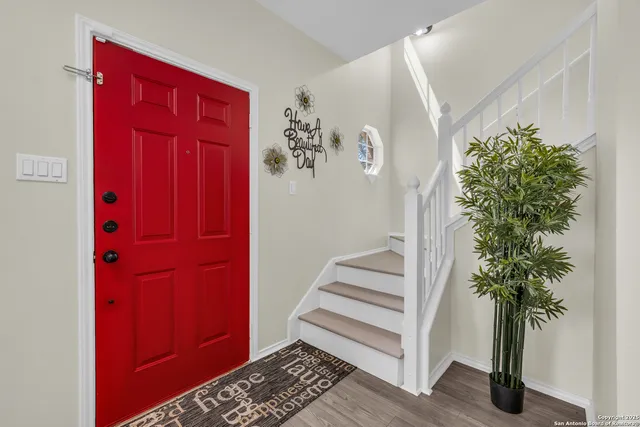 a view of a entryway with a flower pot and a potted plant
