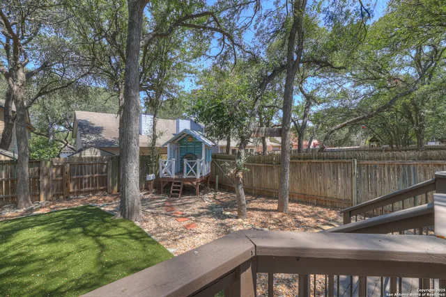 a view of a lake with a house in the background