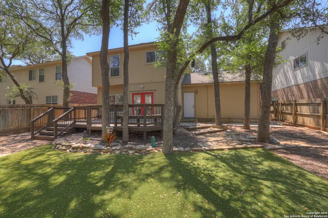 a backyard of a house with lots of green space