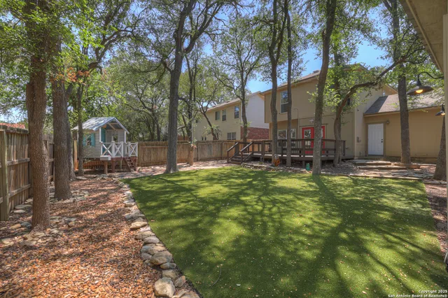 a backyard of a house with lots of green space