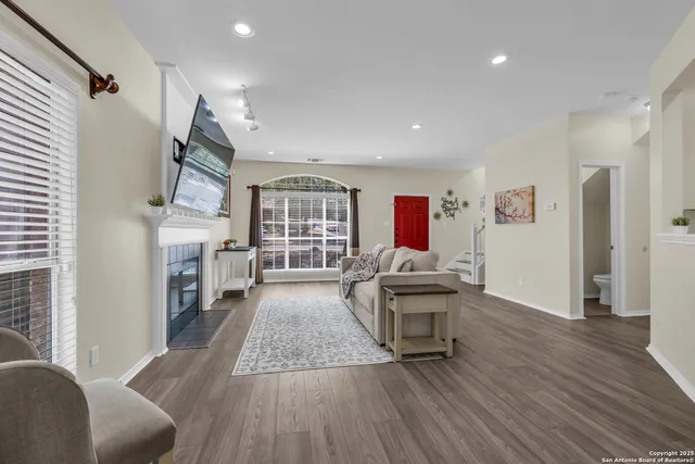 a living room with furniture and a fireplace