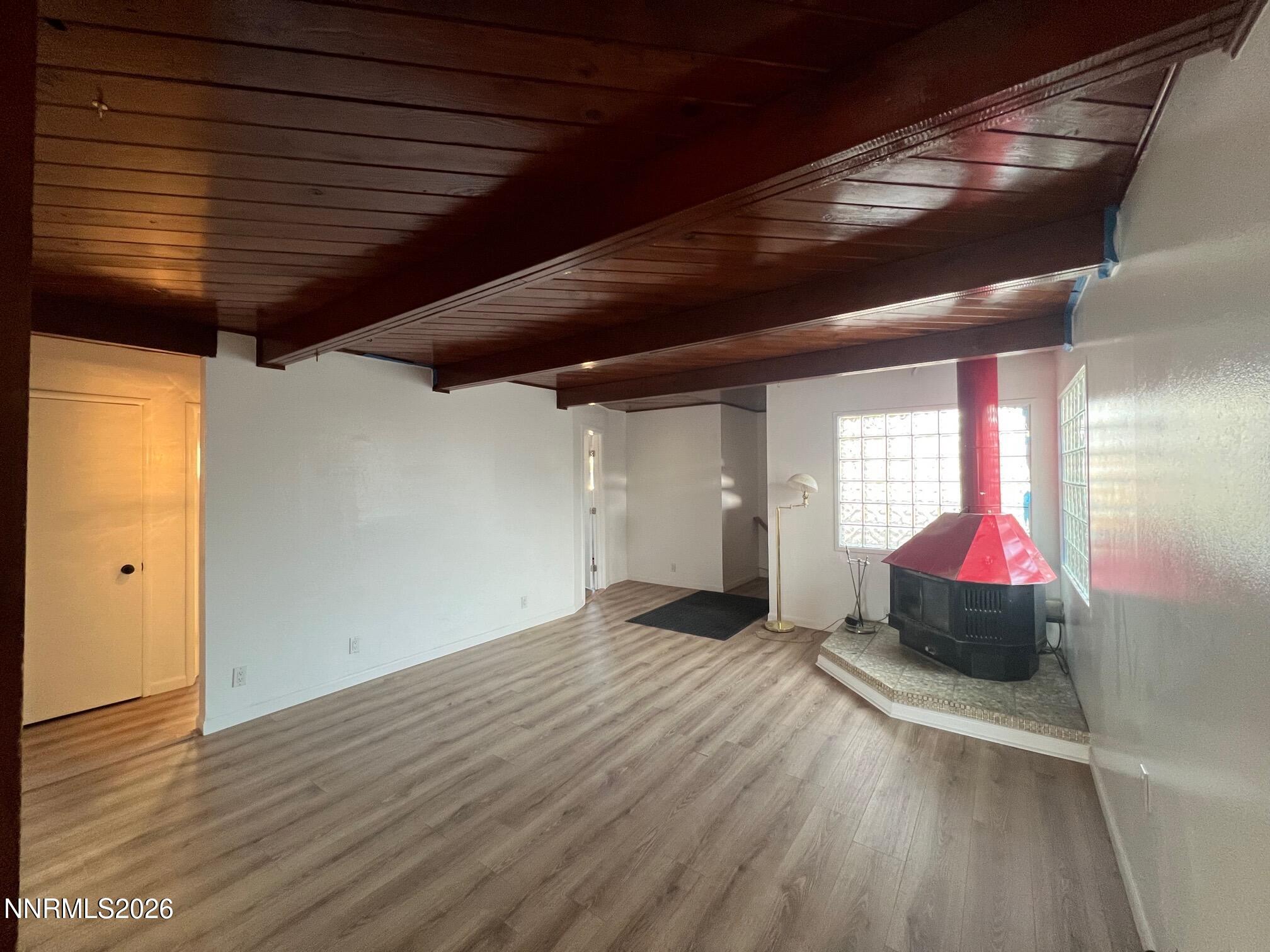 117 West 4th Street Hawthorne, NV 89415 - Photo 11 of 47 a view of an empty room with wooden floor and windows