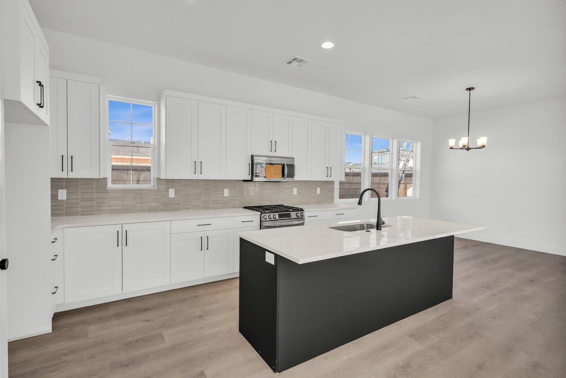 6 Phase Street St. George, UT 84790 - Photo 2 of 10 Kitchen, Quartz Countertops, Stainless Appliances, Lvp Flooring. - Photo of alike unit.