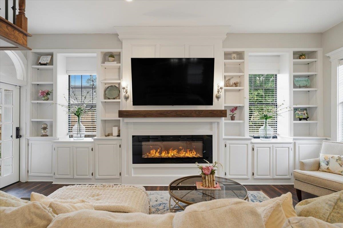 124 Clark Place Memphis, TN 38104 - Photo 15 of 40 a living room with furniture a flat screen tv and a fireplace