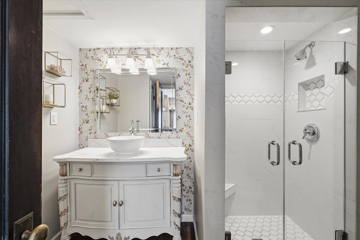 124 Clark Place Memphis, TN 38104 - Photo 19 of 40 a bathroom with a sink vanity and a mirror
