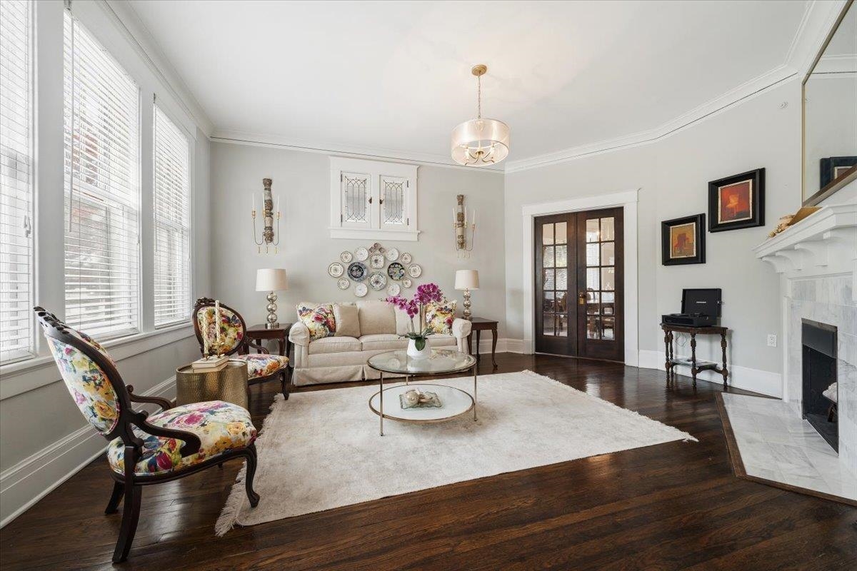 124 Clark Place Memphis, TN 38104 - Photo 2 of 40 a living room with furniture dining table and a fireplace