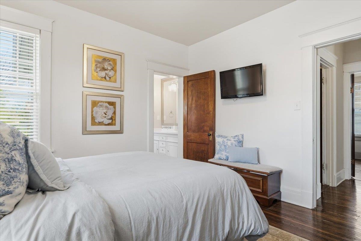 124 Clark Place Memphis, TN 38104 - Photo 22 of 40 a bedroom with a large bed and a tv