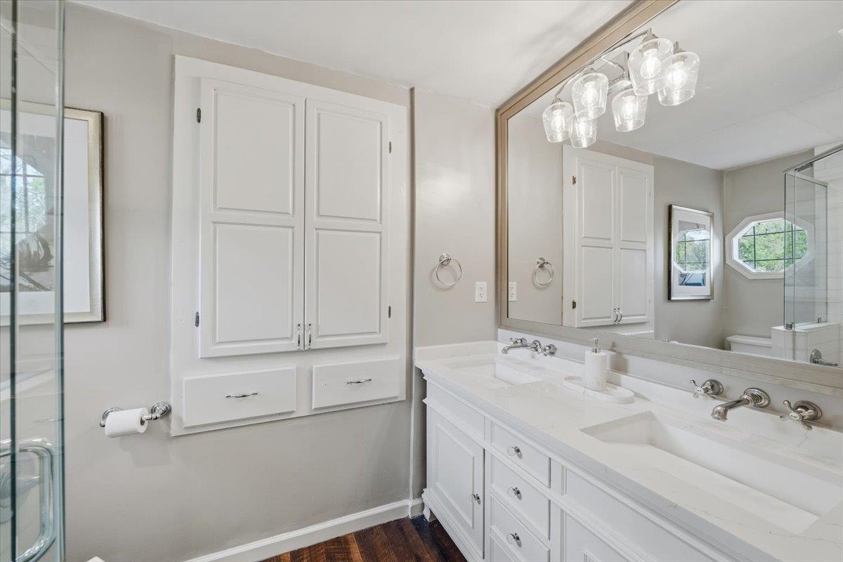 124 Clark Place Memphis, TN 38104 - Photo 23 of 40 a bathroom with a double vanity sink and a mirror