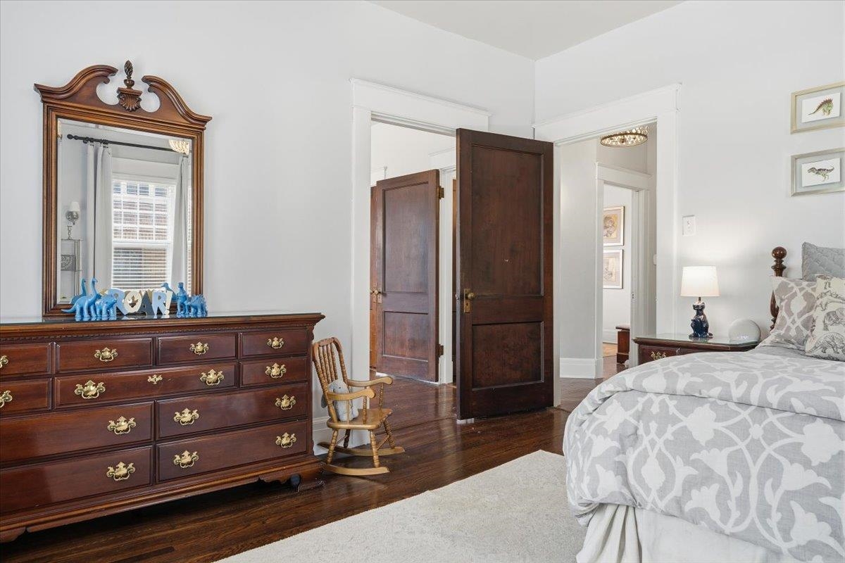 124 Clark Place Memphis, TN 38104 - Photo 29 of 40 a bedroom with a bed and a mirror on dresser