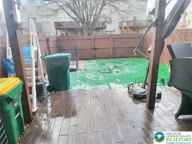 a view of a backyard with sitting area
