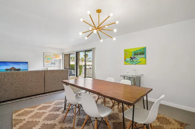 a view of a dining room with furniture and window