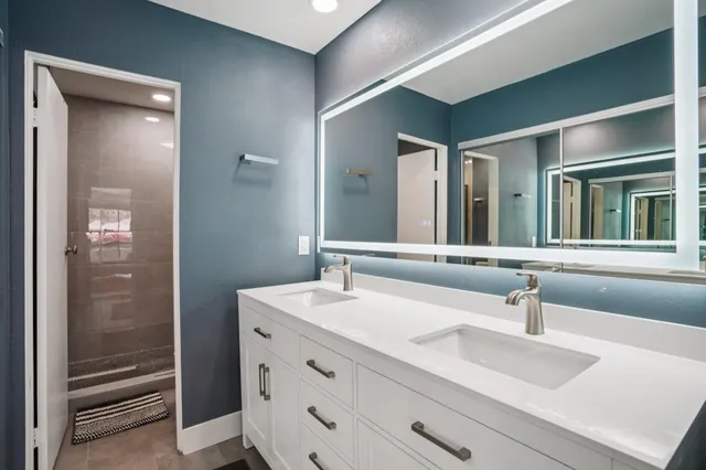 a bathroom with a sink and a mirror