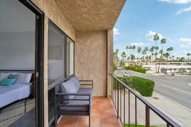 a view of balcony with furniture