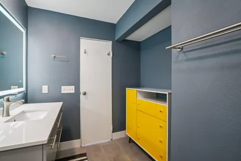 a bathroom with a sink and a mirror