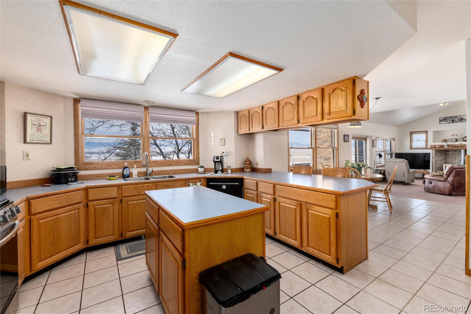 10650 Yellowstone Road Longmont, CO 80504 - Photo 11 of 43 a kitchen with a sink stove and cabinets