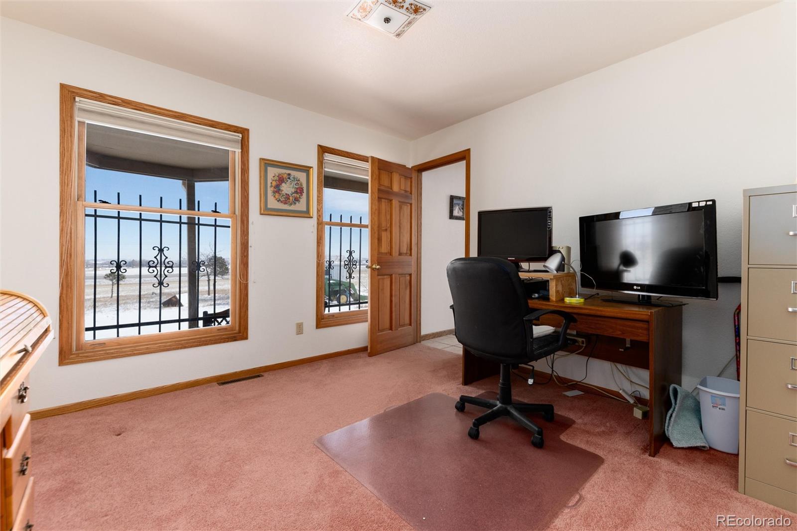 10650 Yellowstone Road Longmont, CO 80504 - Photo 17 of 43 a view of a livingroom with workspace and a window