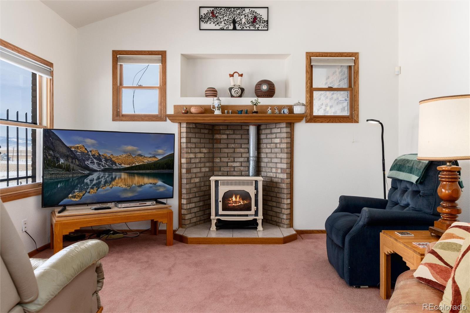 10650 Yellowstone Road Longmont, CO 80504 - Photo 18 of 43 a living room with furniture and a fireplace