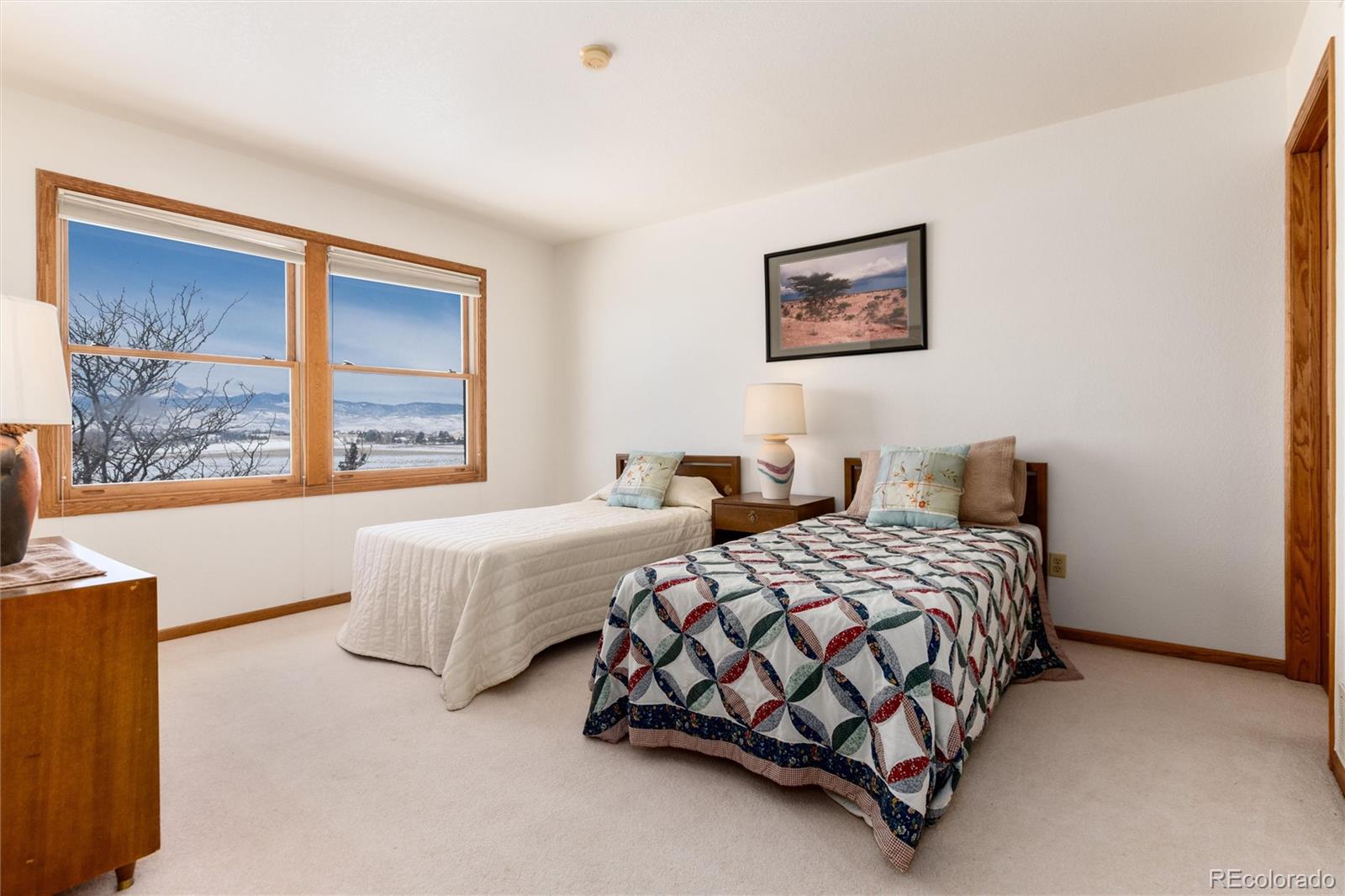 10650 Yellowstone Road Longmont, CO 80504 - Photo 29 of 43 a bedroom with two beds and a couch