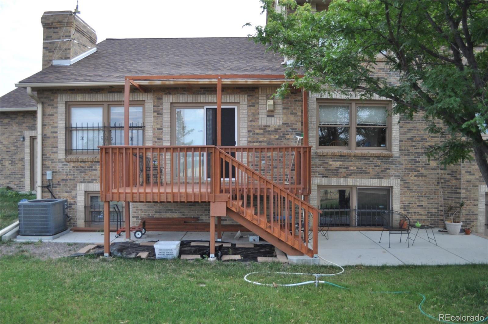 10650 Yellowstone Road Longmont, CO 80504 - Photo 3 of 43 a view of a house with a yard and deck