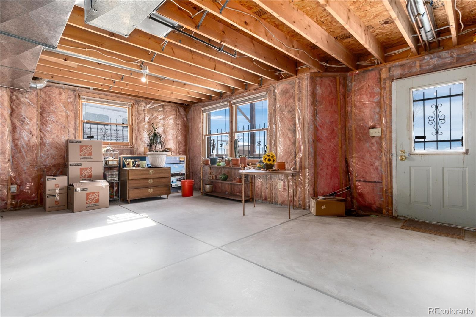 10650 Yellowstone Road Longmont, CO 80504 - Photo 32 of 43 a living room with furniture and a chandelier