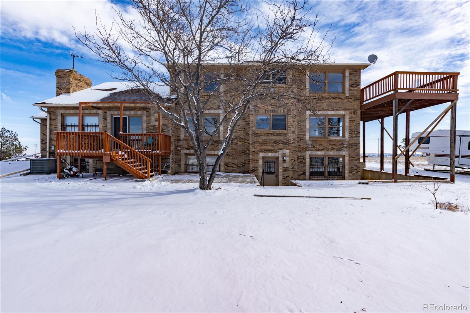 10650 Yellowstone Road Longmont, CO 80504 - Photo 35 of 43 a view of a brick house with many windows