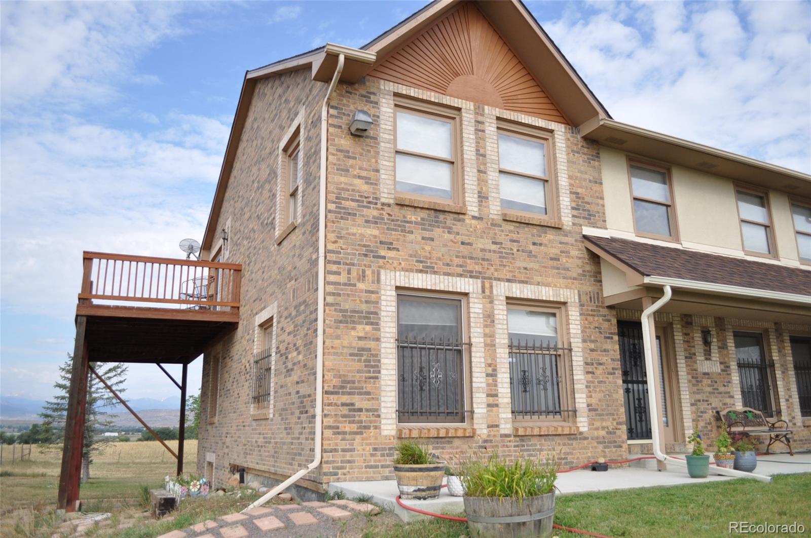 10650 Yellowstone Road Longmont, CO 80504 - Photo 42 of 43 front view of a house with a yard