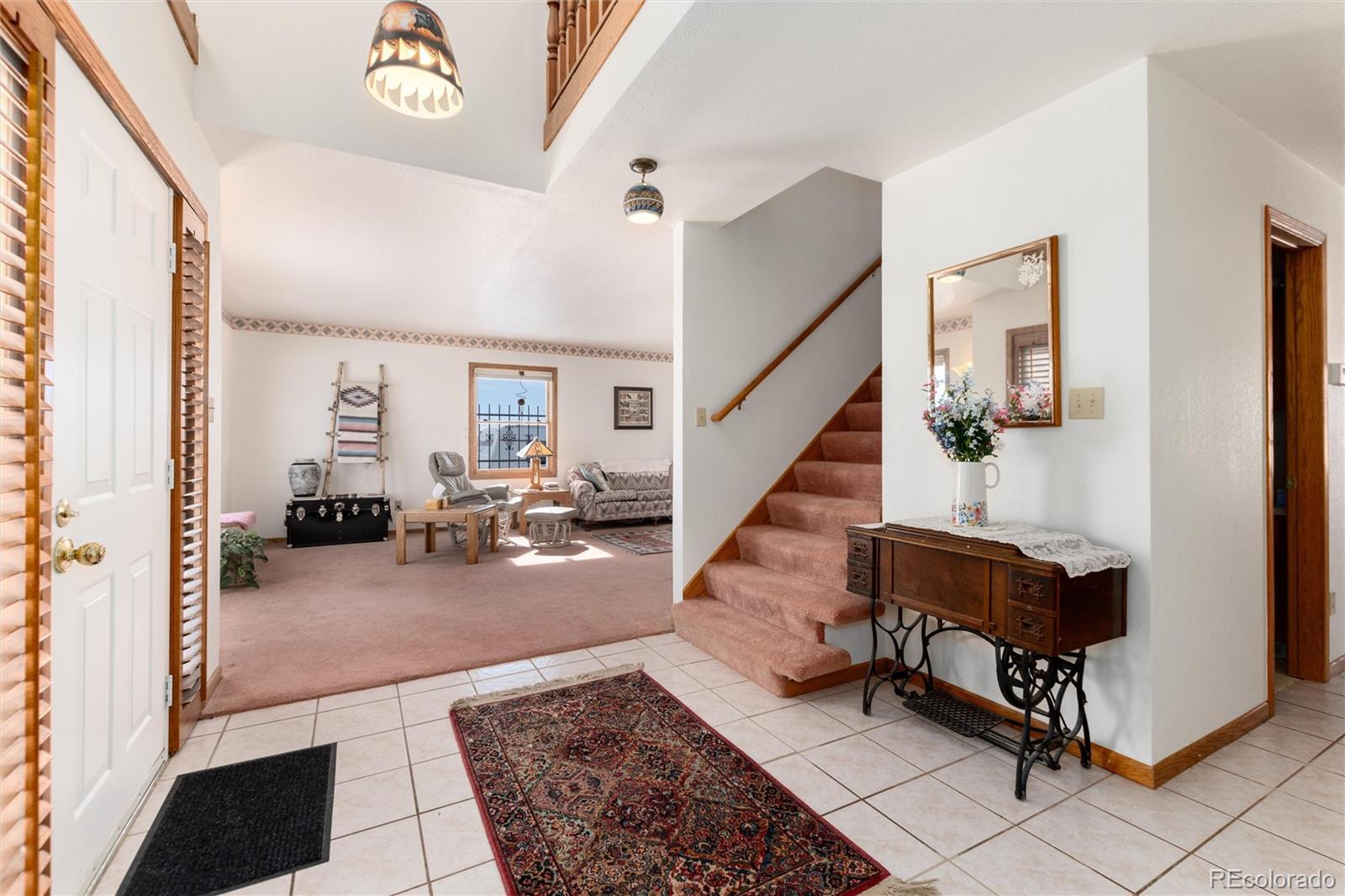 10650 Yellowstone Road Longmont, CO 80504 - Photo 7 of 43 a living room with furniture and a table