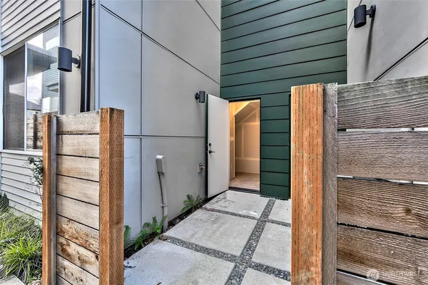 a view of a porch with wooden floor and brick walls