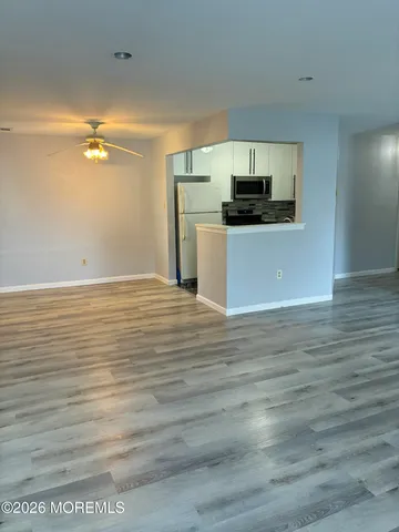 a view of a kitchen from the hallway