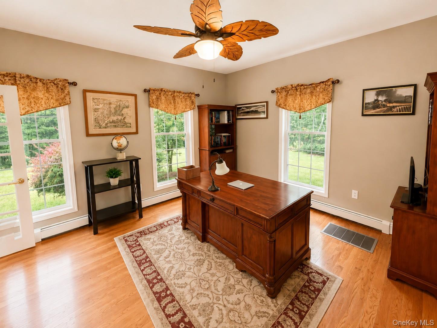 411 Mt Joy Road Middletown, NY 10941 - Photo 31 of 49 Bright interior room featuring wood-finish flooring, light tan wall color, and multiple windows with white trim