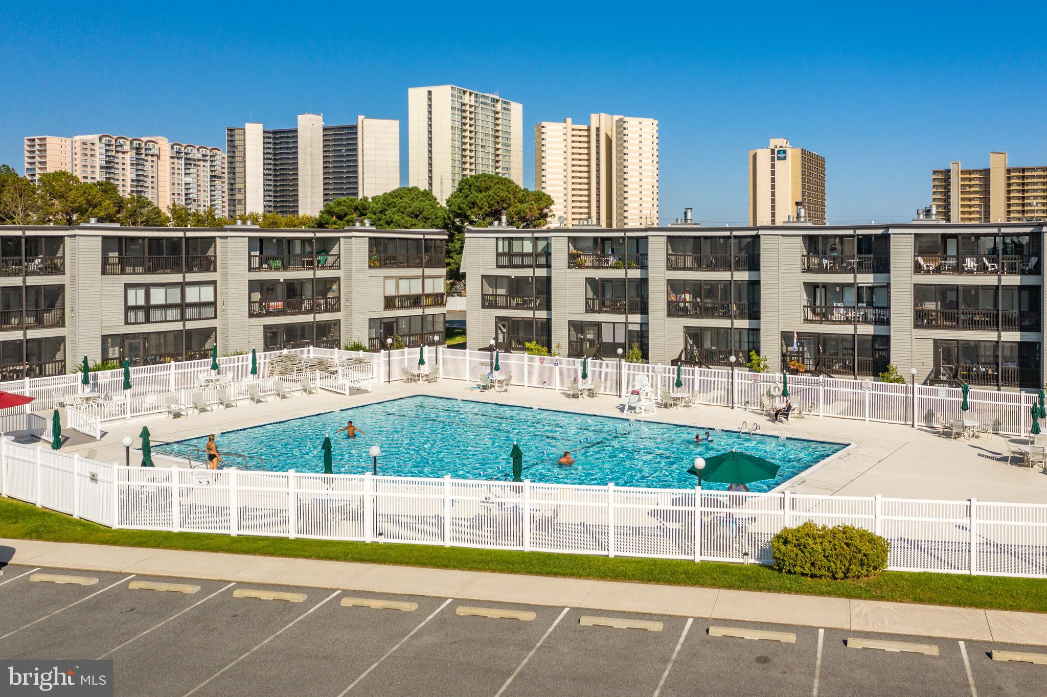 119 Old Landing Road, Unit 302B Ocean City, MD 21842 - Photo 11 of 46 a view of swimming pool of water with tall buildings