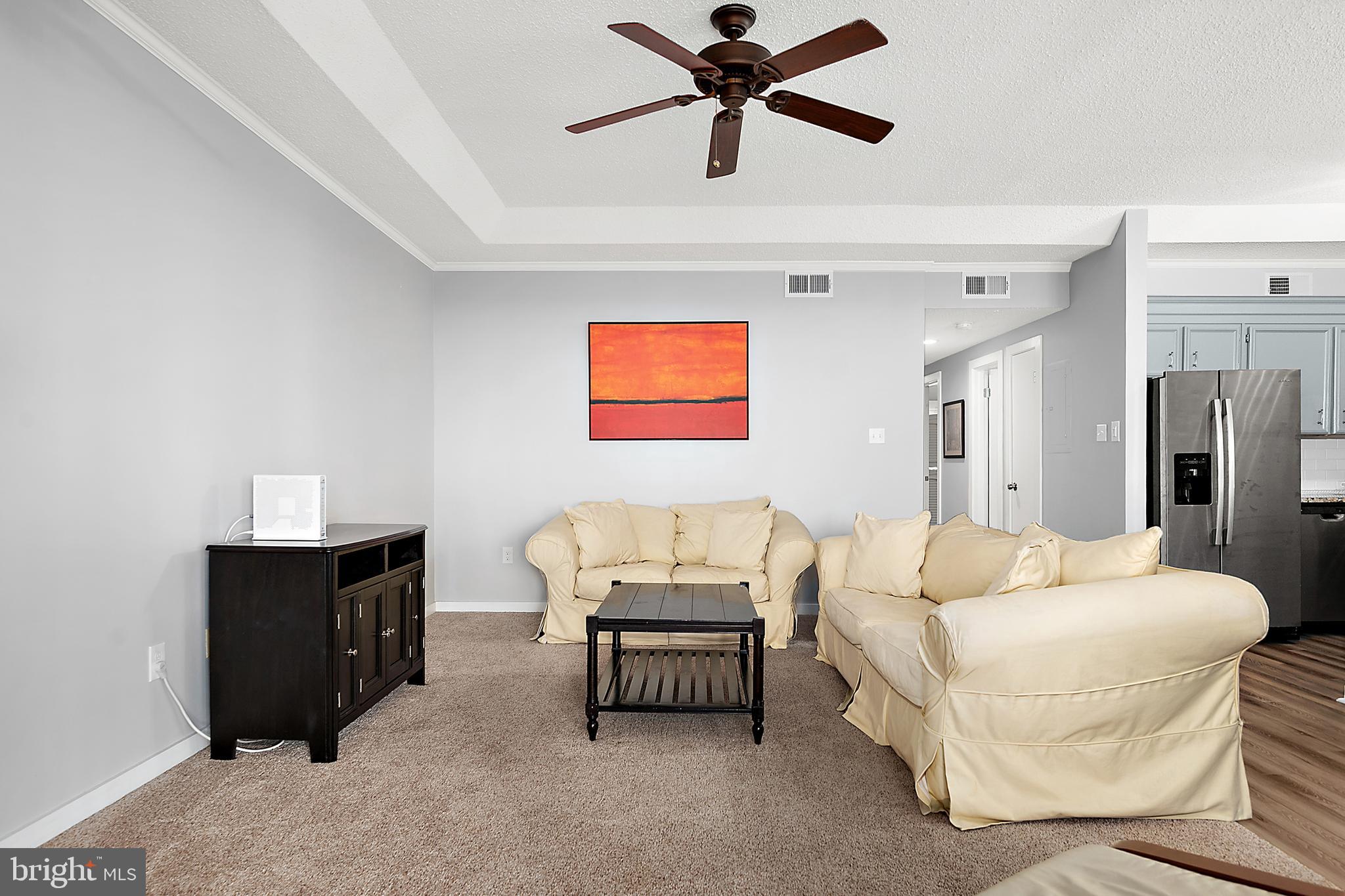 119 Old Landing Road, Unit 302B Ocean City, MD 21842 - Photo 16 of 46 a bedroom with a bed and a couch