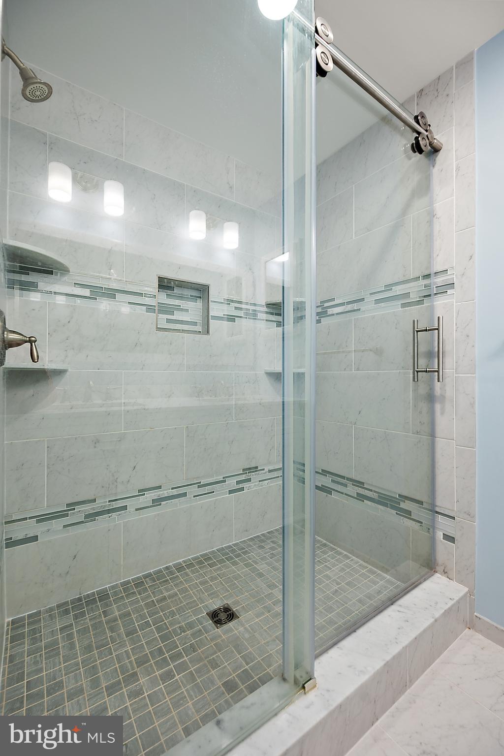 119 Old Landing Road, Unit 302B Ocean City, MD 21842 - Photo 34 of 46 a bathroom with a shower