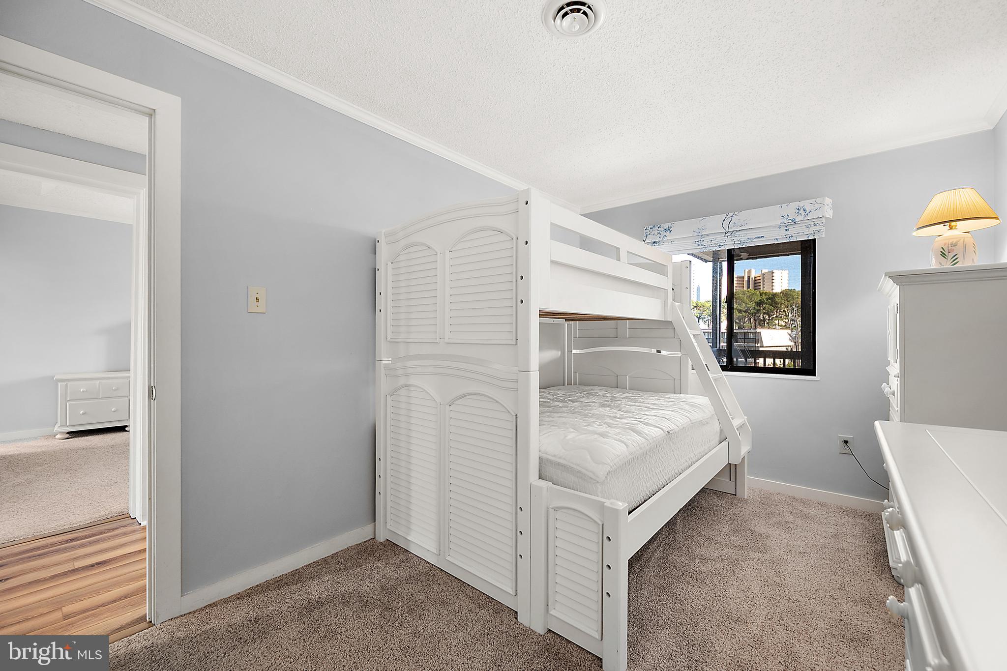 119 Old Landing Road, Unit 302B Ocean City, MD 21842 - Photo 35 of 46 a bedroom with a bed and a window