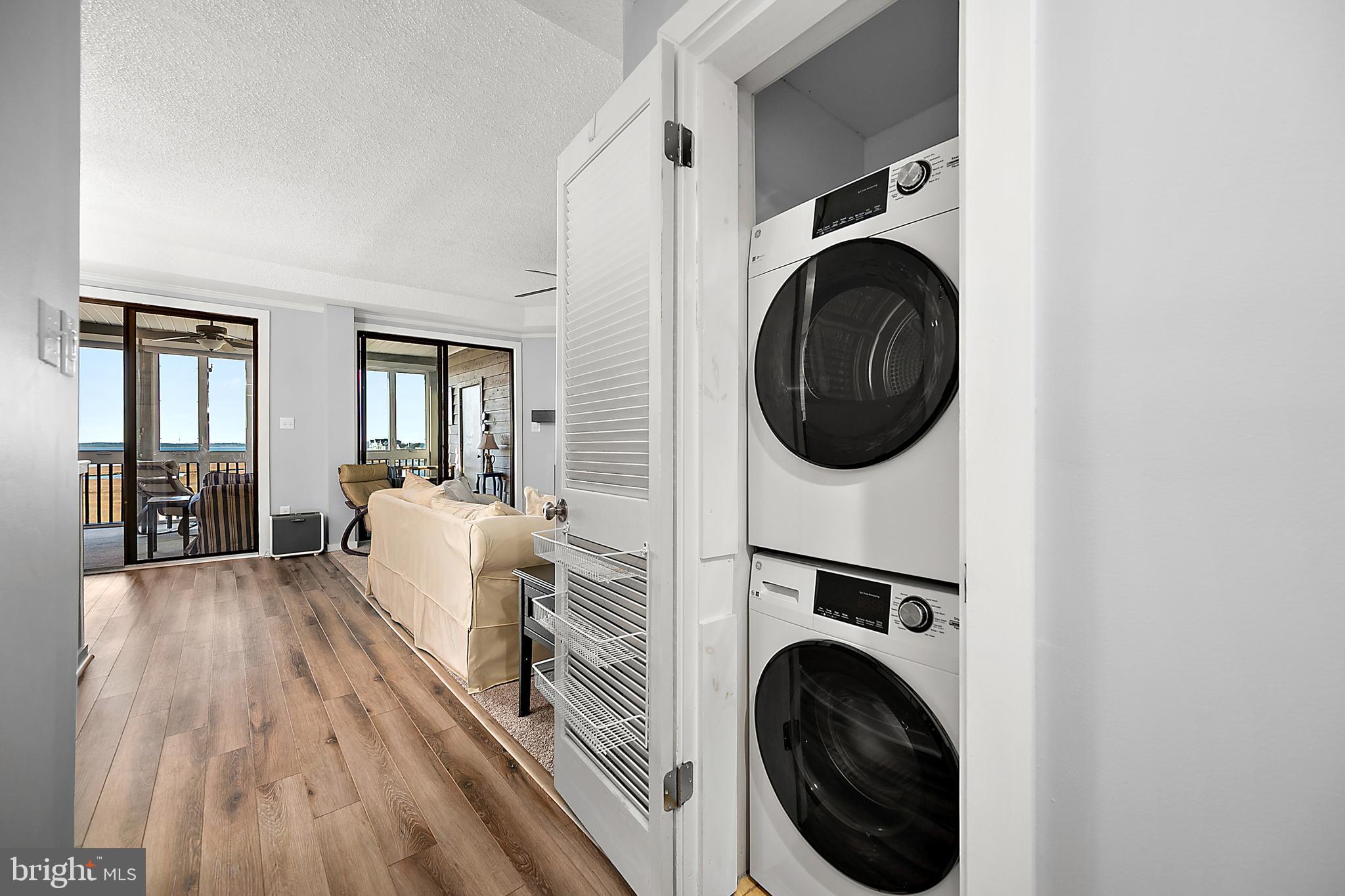 119 Old Landing Road, Unit 302B Ocean City, MD 21842 - Photo 46 of 46 a living room with furniture and a fireplace