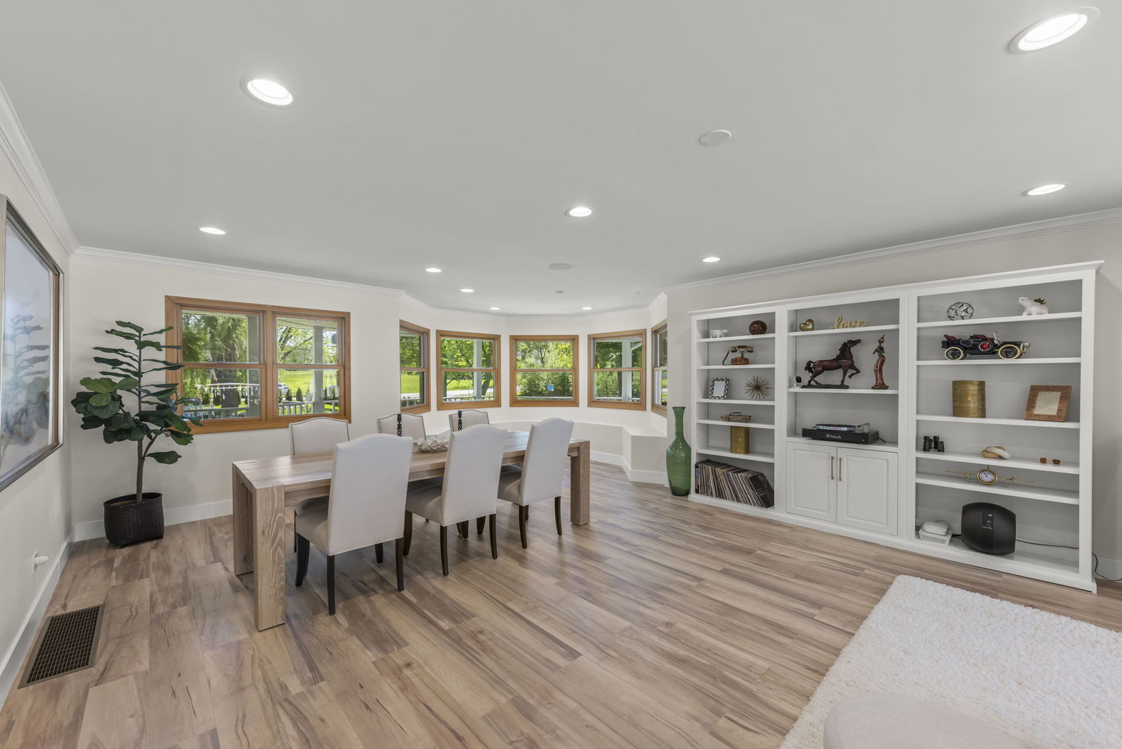 8S452 Bell Drive Naperville, IL 60565 - Photo 17 of 64 a view of a dining room with furniture and wooden floor