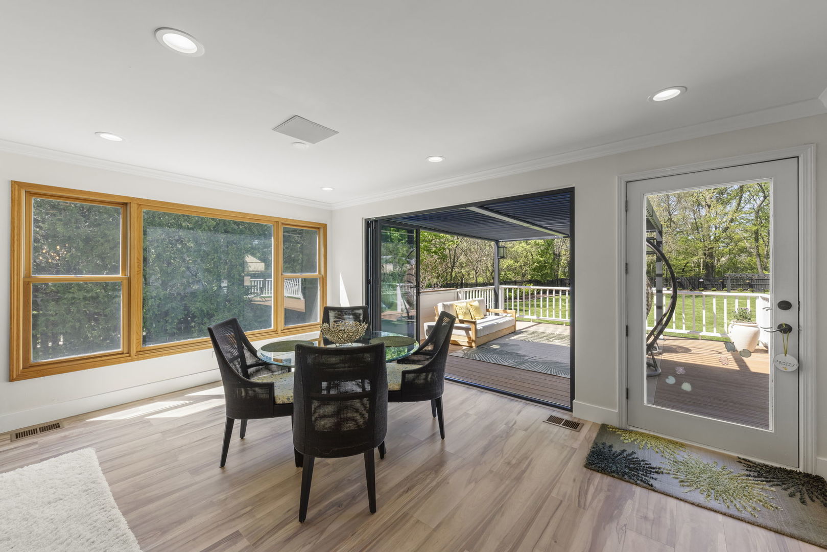 8S452 Bell Drive Naperville, IL 60565 - Photo 19 of 64 a view of a dining room with furniture and wooden floor