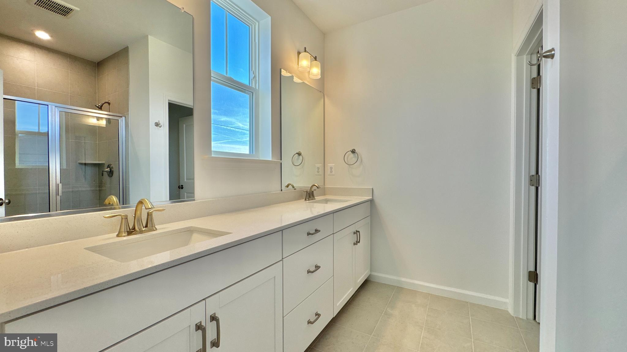 2623 River Birch Road Herndon, VA 20171 - Photo 12 of 12 a bathroom with a sink and a mirror