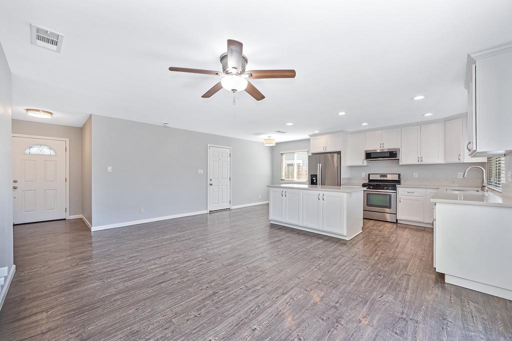 8037 Ruthwood Way Orangevale, CA 95662 - Photo 12 of 37 a view of kitchen with microwave and wooden floor