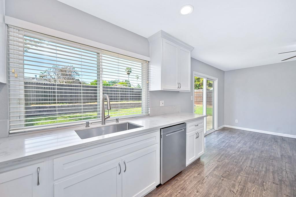 8037 Ruthwood Way Orangevale, CA 95662 - Photo 16 of 37 a kitchen with a sink and a large window