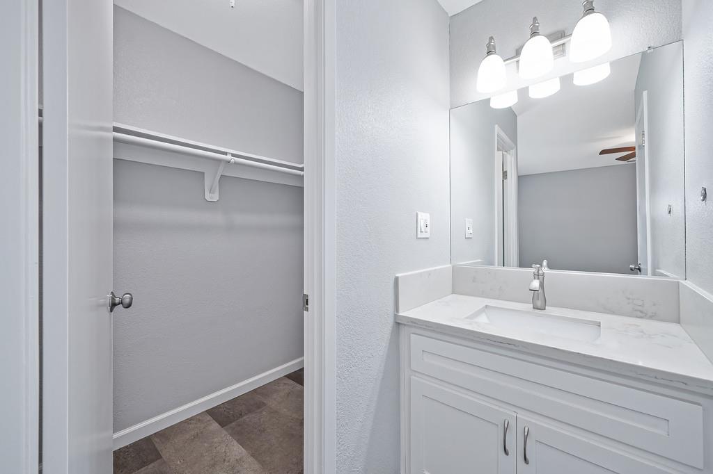 8037 Ruthwood Way Orangevale, CA 95662 - Photo 19 of 37 a bathroom with a sink vanity and a mirror