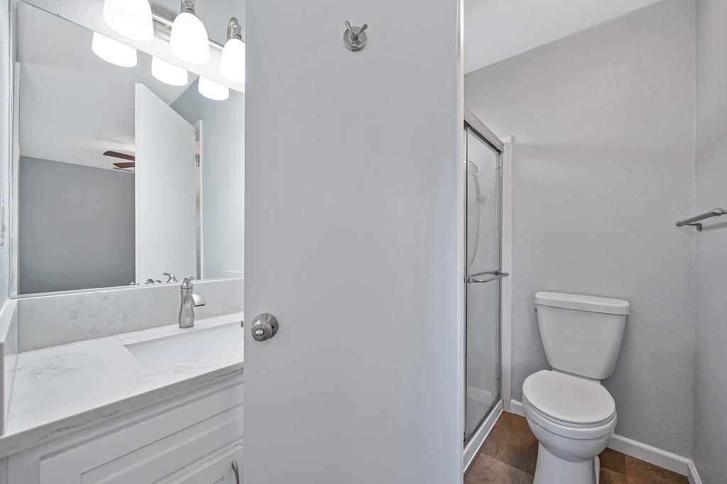 8037 Ruthwood Way Orangevale, CA 95662 - Photo 21 of 37 a bathroom with a sink a toilet and a mirror