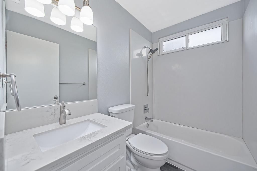 8037 Ruthwood Way Orangevale, CA 95662 - Photo 23 of 37 a bathroom with a sink a toilet and a bathtub