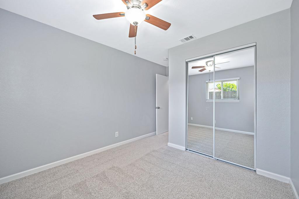 8037 Ruthwood Way Orangevale, CA 95662 - Photo 27 of 37 an empty room with windows and fan