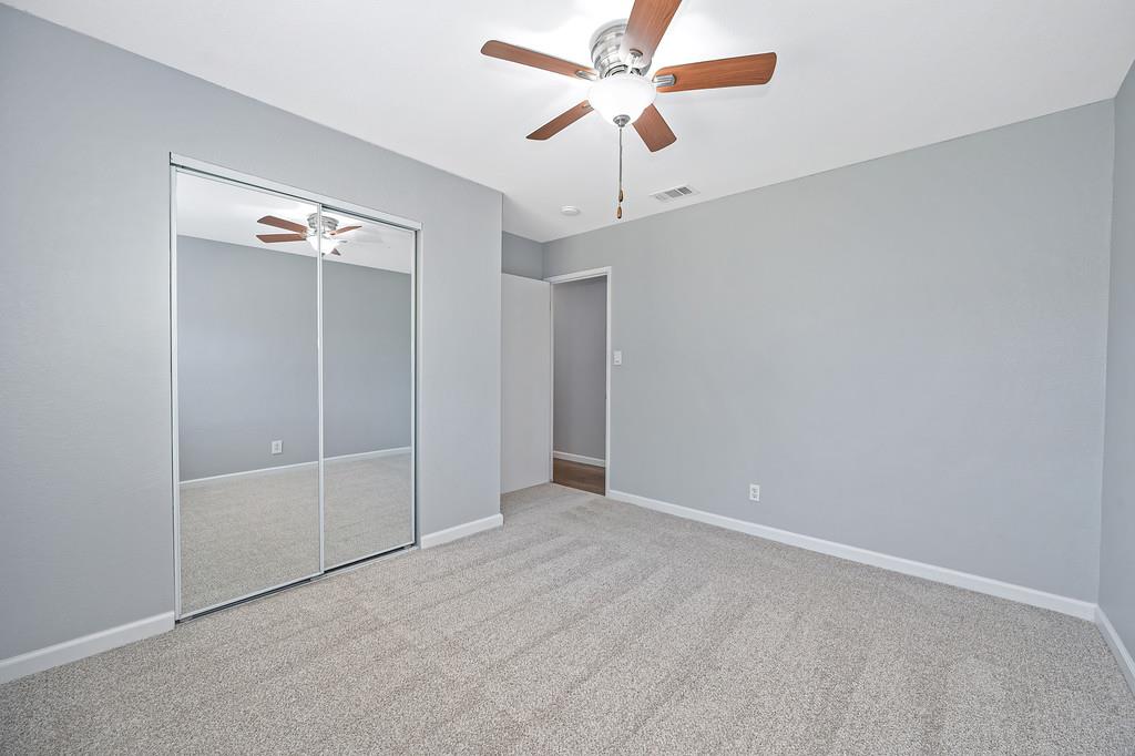 8037 Ruthwood Way Orangevale, CA 95662 - Photo 30 of 37 an empty room with a fan & a window
